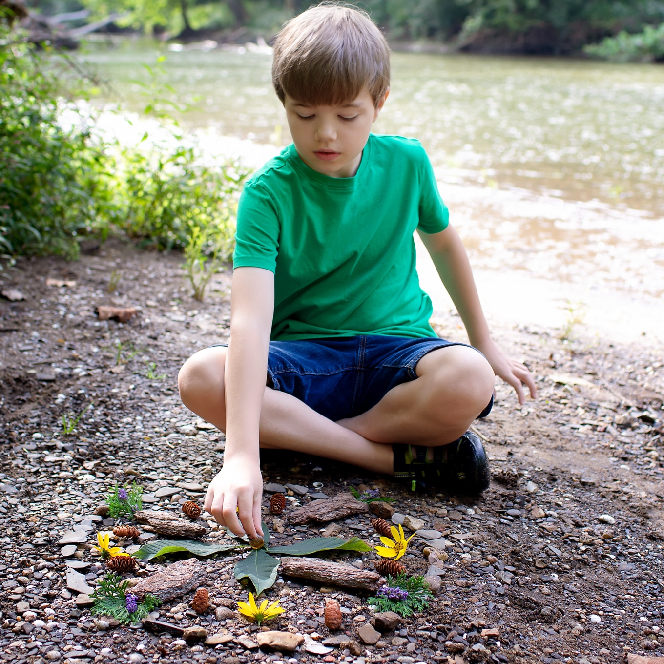 Child Creating a Nature Mandala - From the Book Sticks and Stones Child Creating a Nature Mandala - From the Book Sticks and Stones