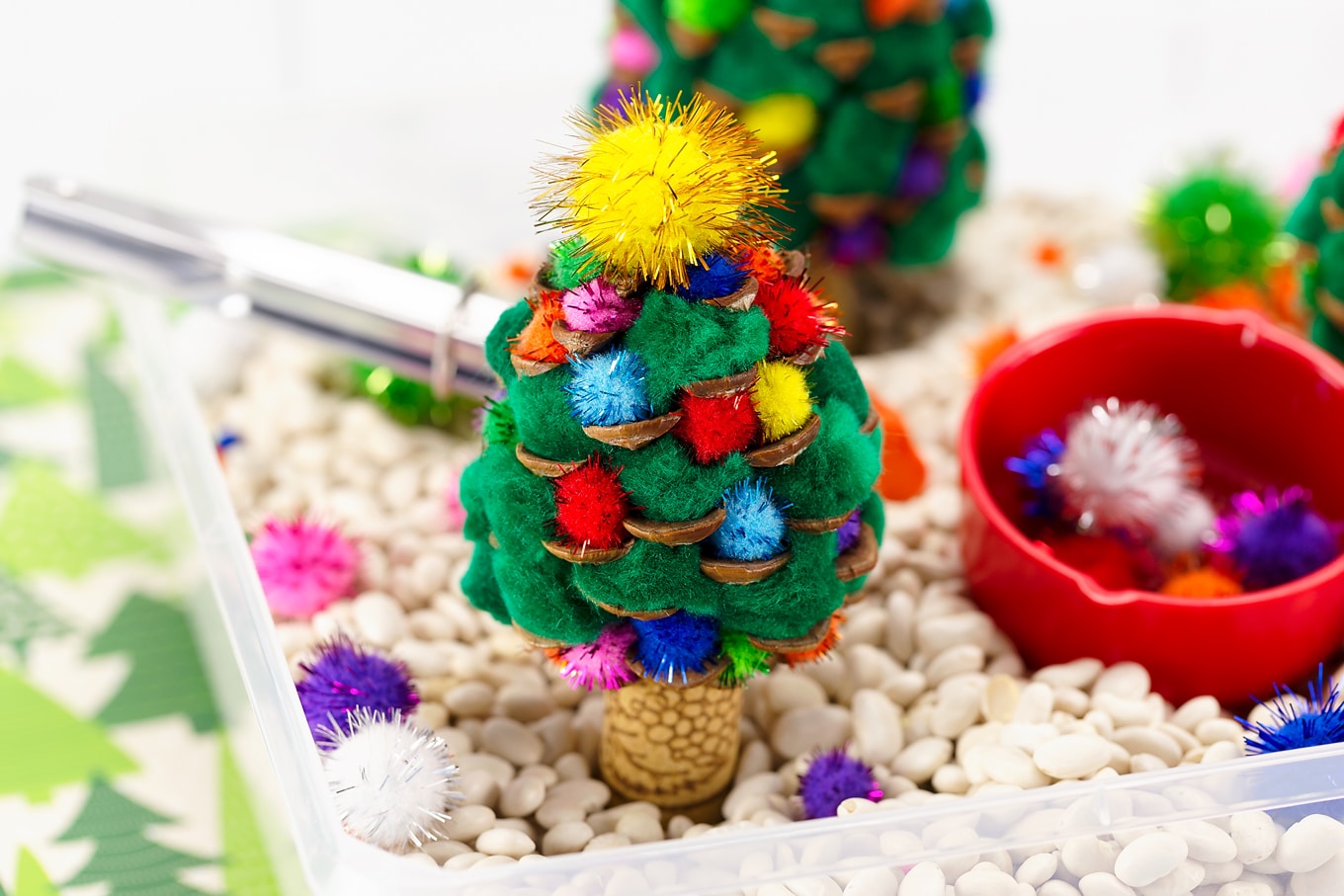 Pine Cone Christmas Trees in a Sensory Bin