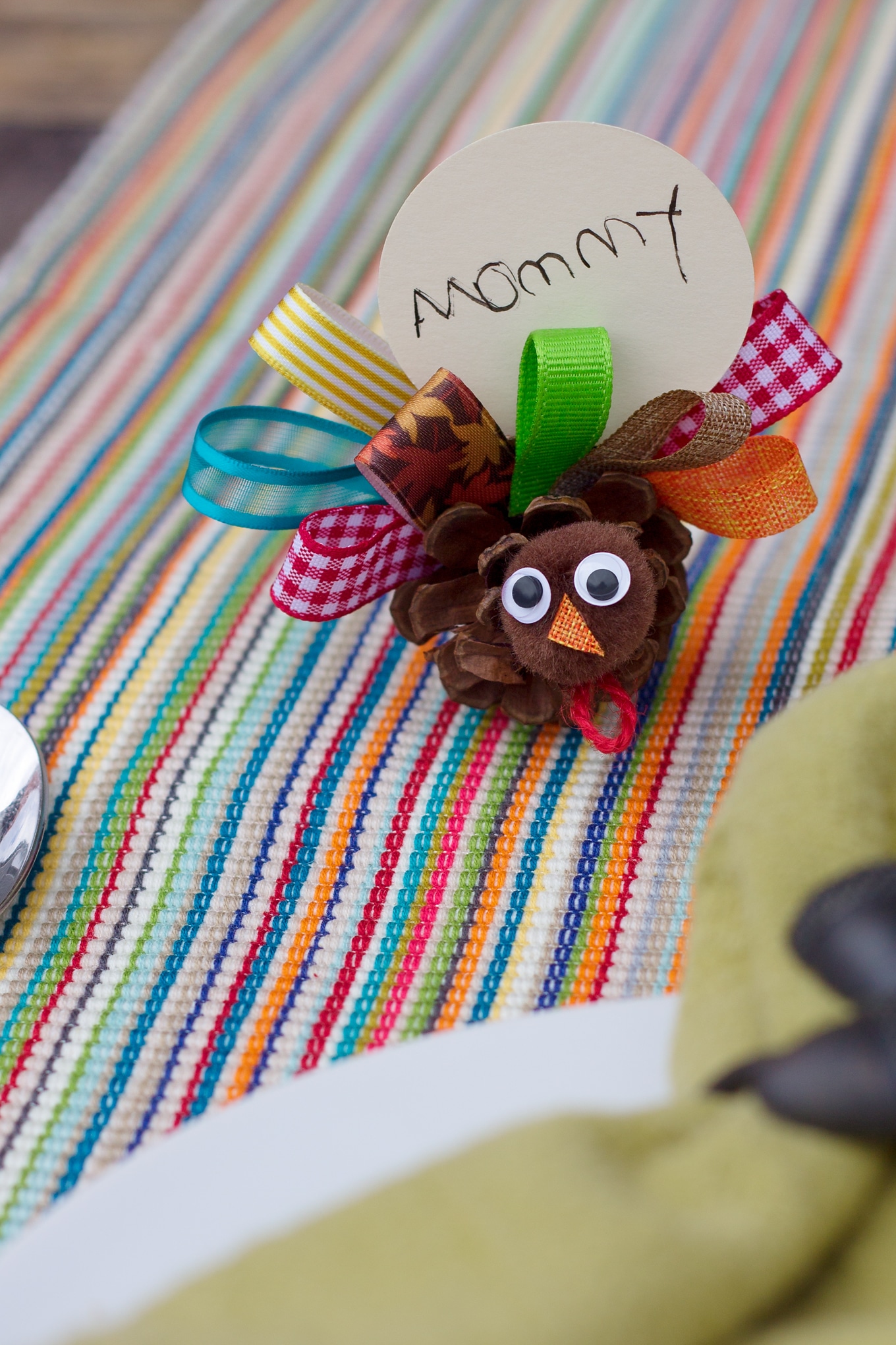 Pine Cone Turkey Craft Just in time for Thanksgiving, learn how to make Scrap Ribbon Pine Cone Turkeys from ribbon, pine cones, and pom poms. It's the perfect nature craft for kids!