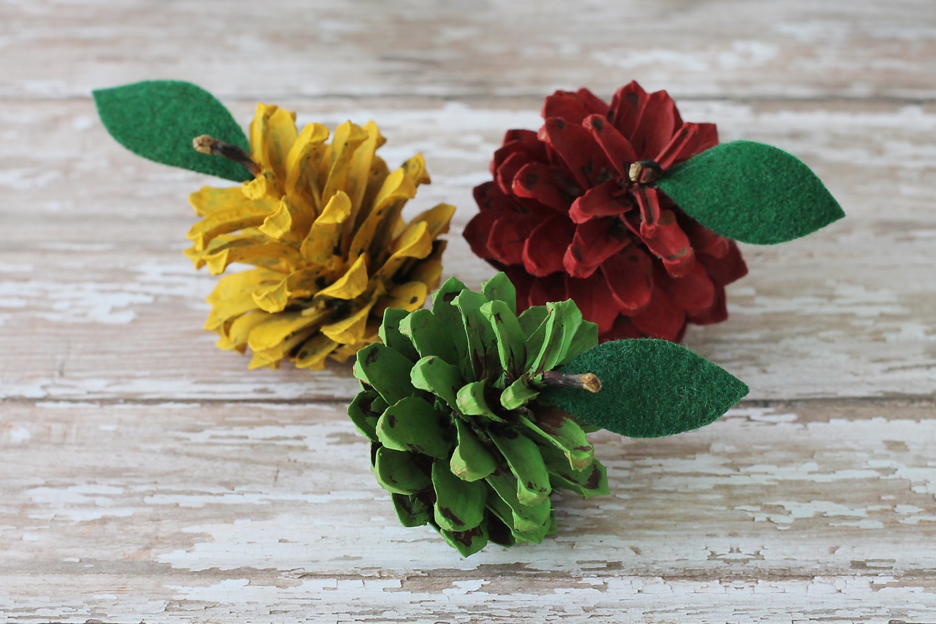 Kids of all ages will enjoy making pine cone apples. They are a creative, colorful fall nature craft for kids!