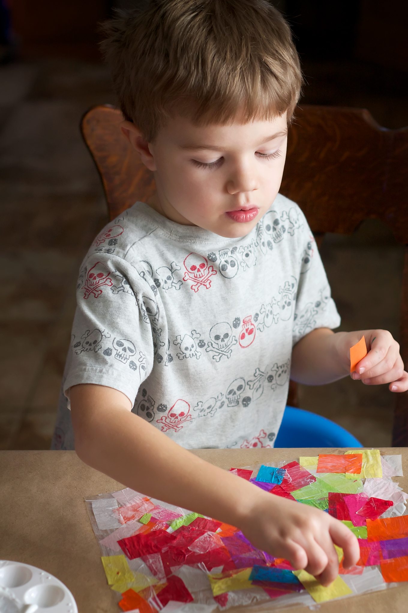 Child Making Rainbow Heart Suncatchers Child making rainbow heart suncatcher.