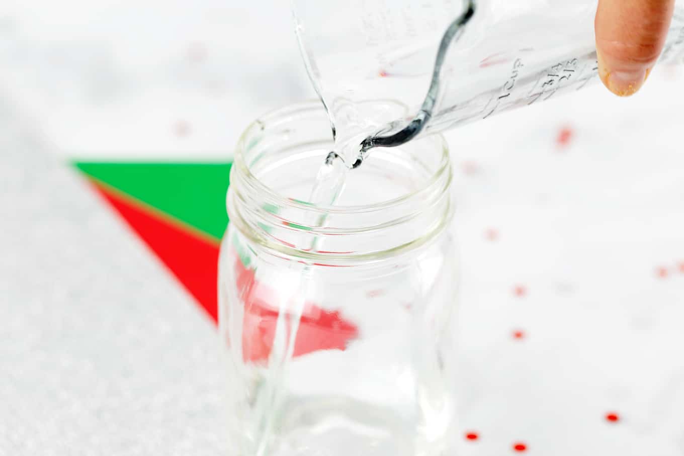 Step 1 of Glitter Jars - Pour Water into Jar