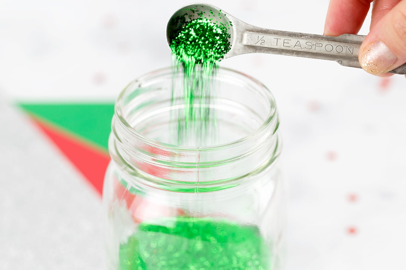 Step 3 of Glitter Jars - Pour Glitter into Jar