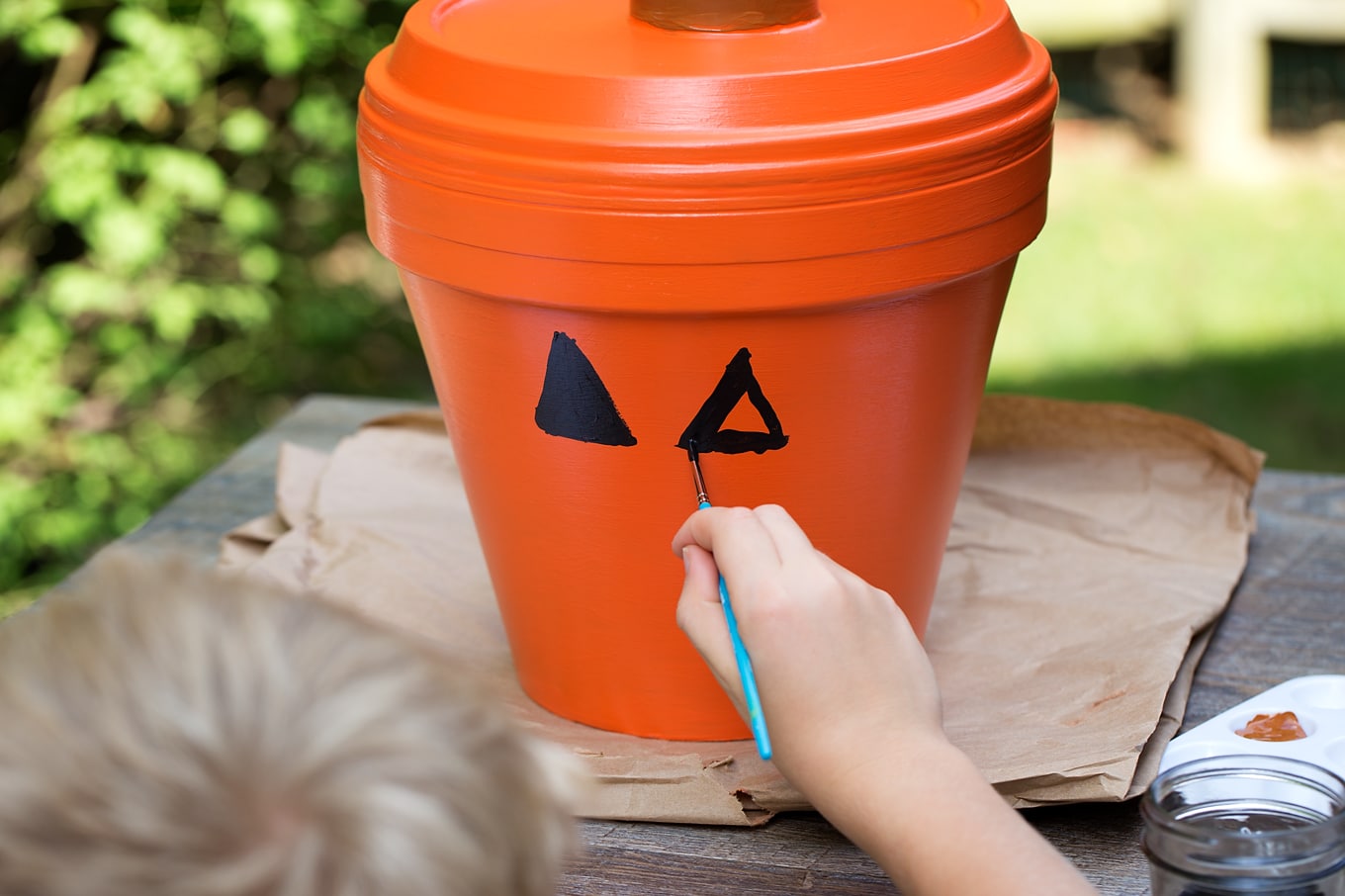 Terracotta Pot Jack O'Lantern Craft Bring a little Halloween fun to your garden, patio, or porch with this easy Terracotta Pot Jack O'Lantern Craft. It's a fun Halloween craft for kids!