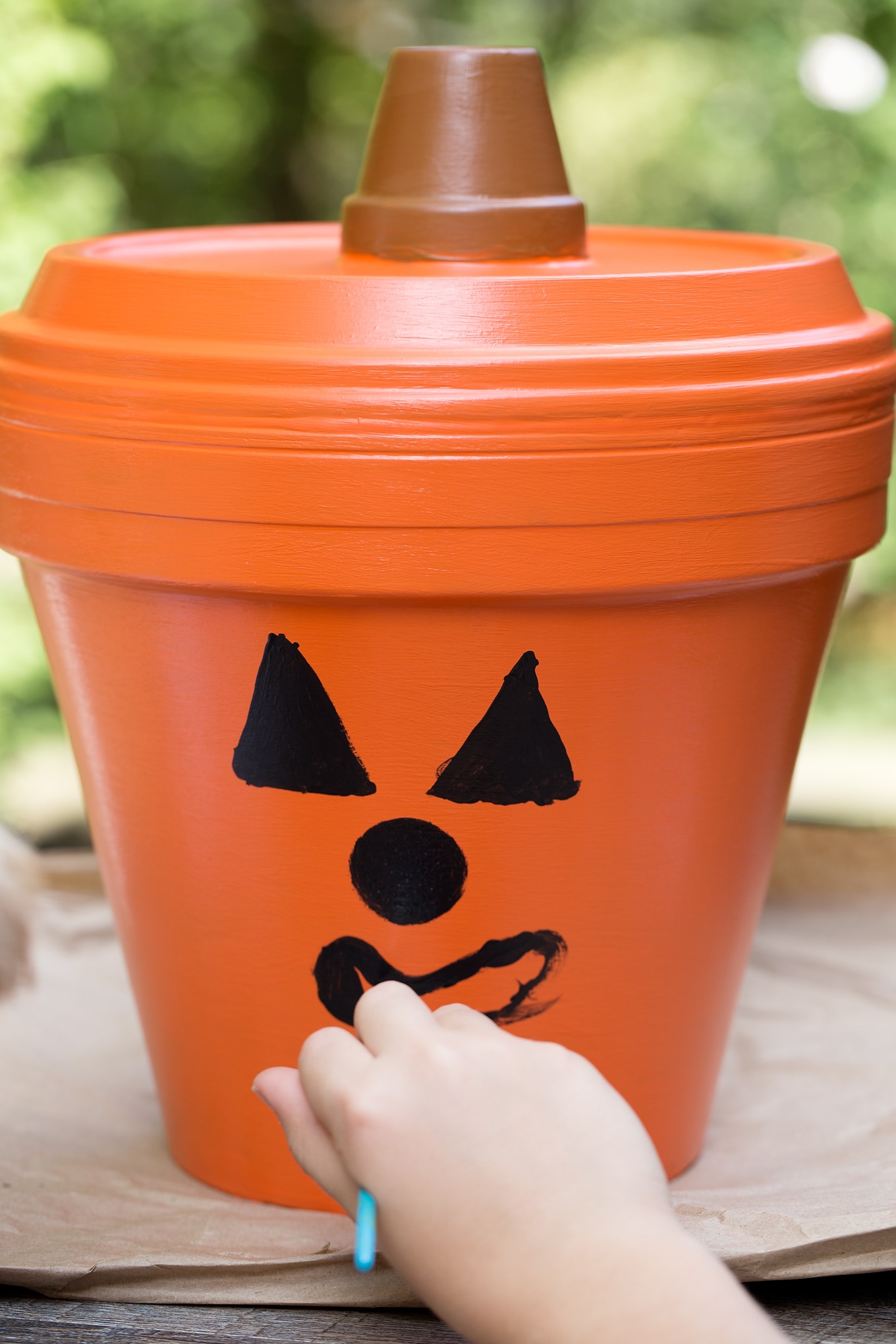 Terracotta Pot Jack O'Lantern Craft Bring a little Halloween fun to your garden, patio, or porch with this easy Terracotta Pot Jack O'Lantern Craft. It's a fun Halloween craft for kids!